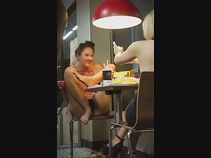 Upskirt of a silly teen girl in a fast food Picture 7