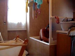 Young sis is spied naked in the bathroom Picture 3