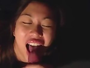 Happy asian girl gets cum on her tongue Picture 1
