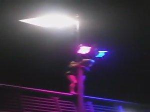 Slutty girl dances up on a bridge Picture 2