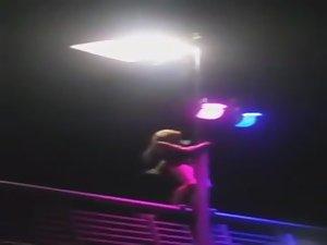 Slutty girl dances up on a bridge Picture 3