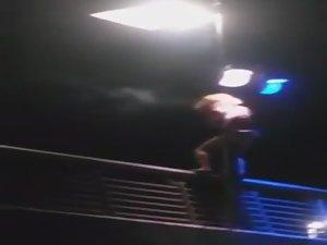 Slutty girl dances up on a bridge Picture 5