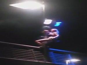 Slutty girl dances up on a bridge Picture 6