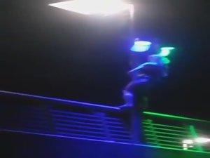 Slutty girl dances up on a bridge Picture 8