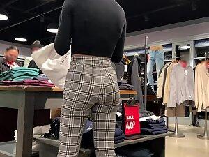 Checking out store clerk's ass while she folds clothes Picture 1