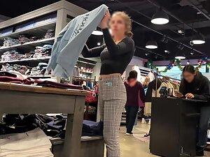 Checking out store clerk's ass while she folds clothes Picture 2