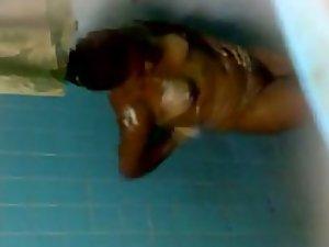 Spying on dark skinned lady showering Picture 1