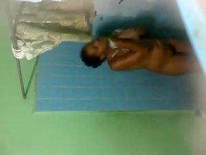 Spying on dark skinned lady showering Picture 2