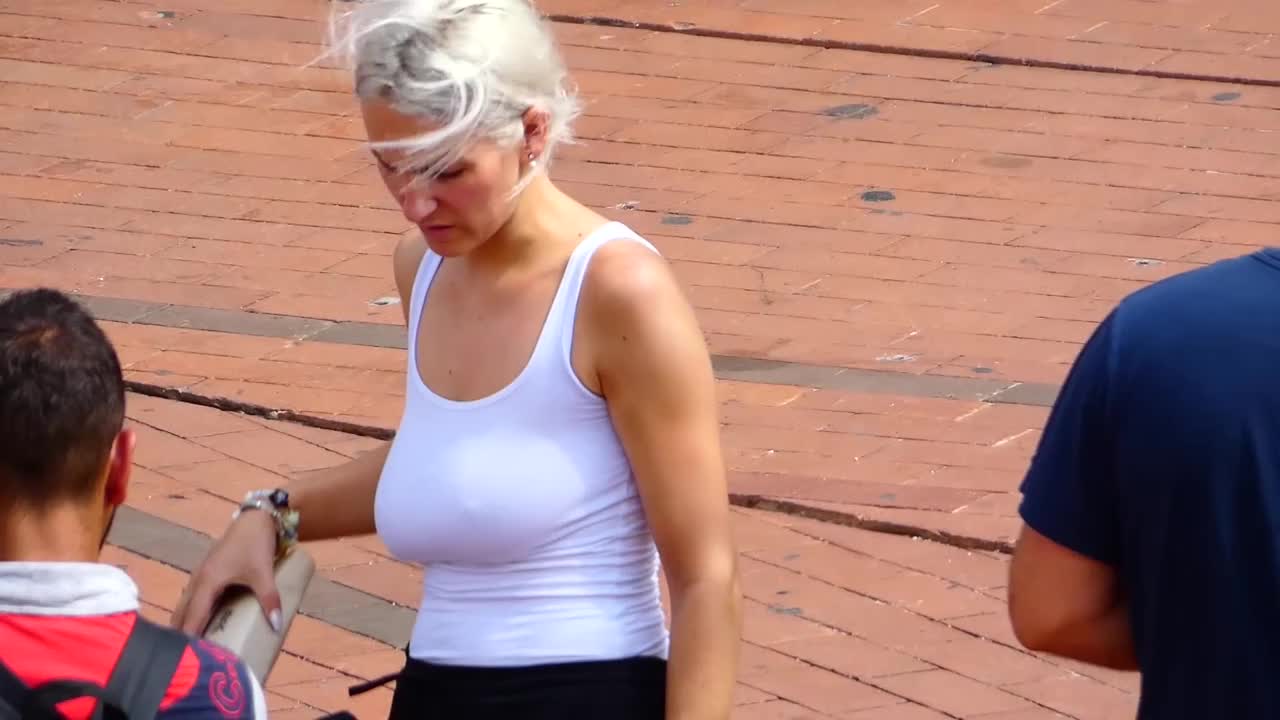 Braless blonde with very big boobs