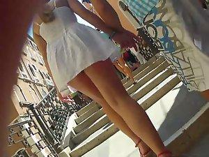 Upskirt of a girl holding hands with a guy Picture 6