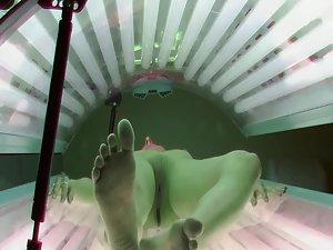 Skinny brunette peeped in a tanning bed Picture 3
