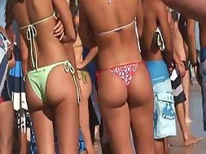 Irresistible asses of two girls at a beach