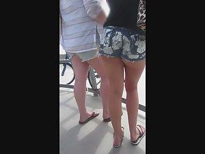 One half of naked butt cheek in booty shorts Picture 3