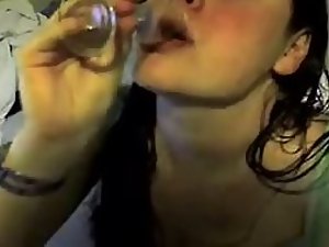 Offbeat girl drinks cum from a glass