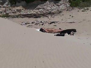 Sexy girl caught tanning on a lone beach Picture 8
