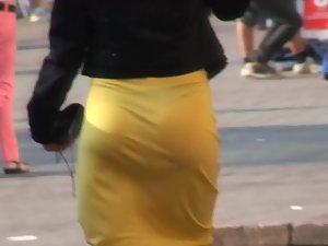 Black thong visible through sexy yellow skirt Picture 3