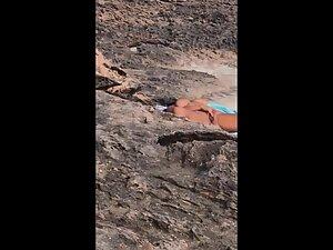 Nudist woman rubbing pussy is caught by beach voyeur Picture 3