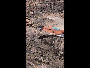 Nudist woman rubbing pussy is caught by beach voyeur Picture 4