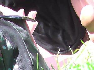 Pussy touching the grass in upskirt Picture 2