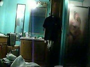 She masturbates under a shower Picture 1