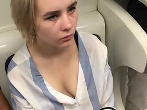 Serious looking girl with nice tits on the train