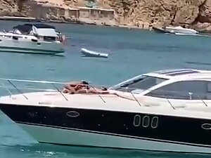 Blowjob on a yacht is recorded from the shore