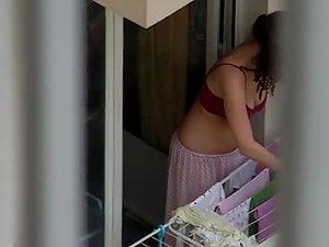 Lovely neighbor girl is hanging clothes Picture 6