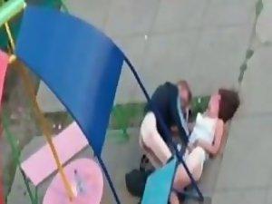 Silly couple trying to fuck on playground