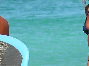 Hot beach girls paddle their surfboard Picture 1