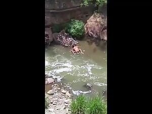 Sex in the river caught from a tall nearby building Picture 7