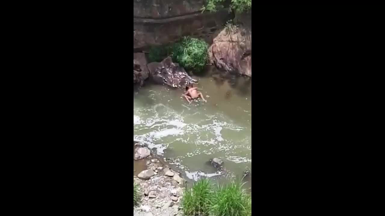 Sex in the river caught from a tall nearby building