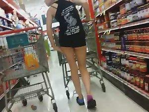 Sexy chick in shorts at supermarket Picture 1