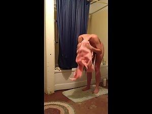 Cute naked girl wipes off her wet body Picture 3