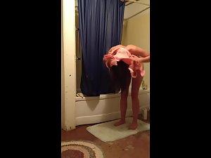 Cute naked girl wipes off her wet body Picture 4