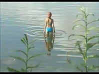 Teen girl spied as she swims in a lake Picture 2