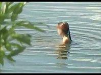 Teen girl spied as she swims in a lake Picture 6