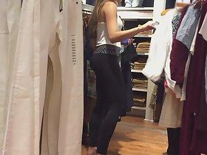 Stunning girl gets on her knees in store Picture 2