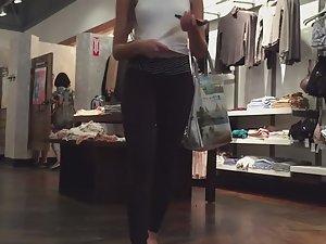 Stunning girl gets on her knees in store Picture 8