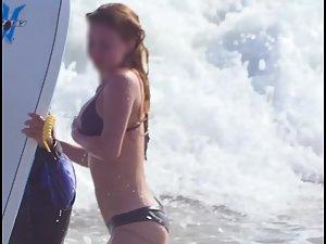 Busty ginger girl enjoys big waves in the water Picture 5
