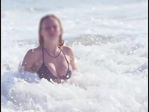 Busty ginger girl enjoys big waves in the water Picture 6