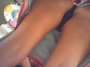 Upskirt shows her tanned ass and black thong Picture 3