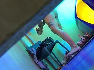 Peeping on epic tattooed girl in tanning studio Picture 5