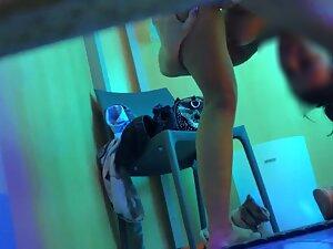Peeping on epic tattooed girl in tanning studio Picture 8