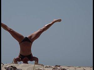 Epic girl does her exercises on the beach Picture 2