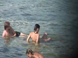 Skinny nude girl creeped on at a beach Picture 7