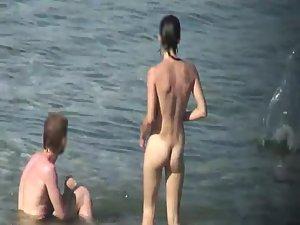 Skinny nude girl creeped on at a beach Picture 8