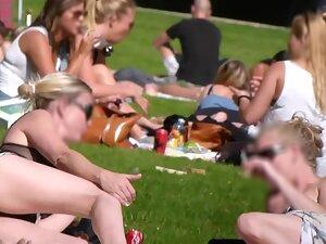 Upskirt of hot blonde friends relaxing in the park Picture 1