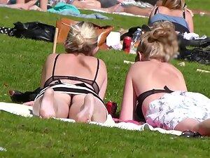Upskirt of hot blonde friends relaxing in the park Picture 2