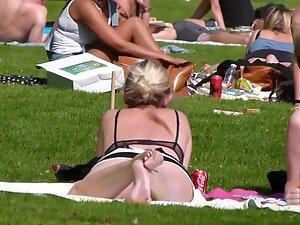 Upskirt of hot blonde friends relaxing in the park Picture 3