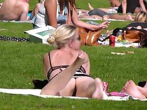 Upskirt of hot blonde friends relaxing in the park Picture 4